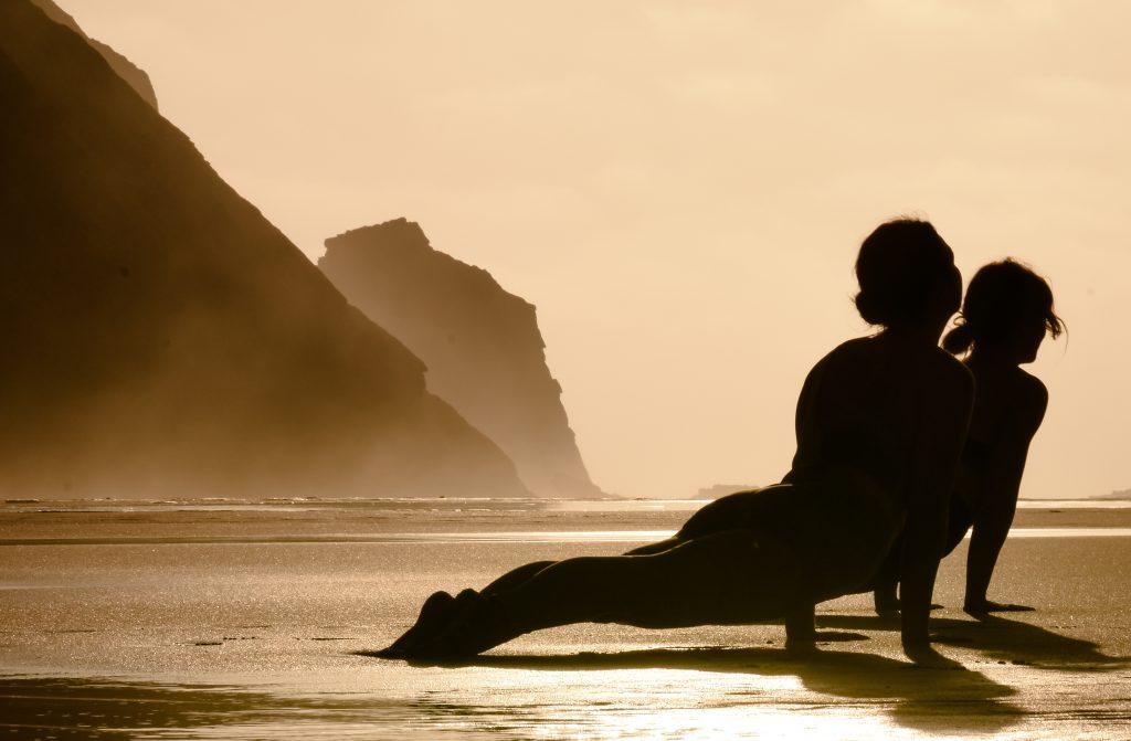 Outdoor yoga class surrounded by nature at Soul & Surf Portuga